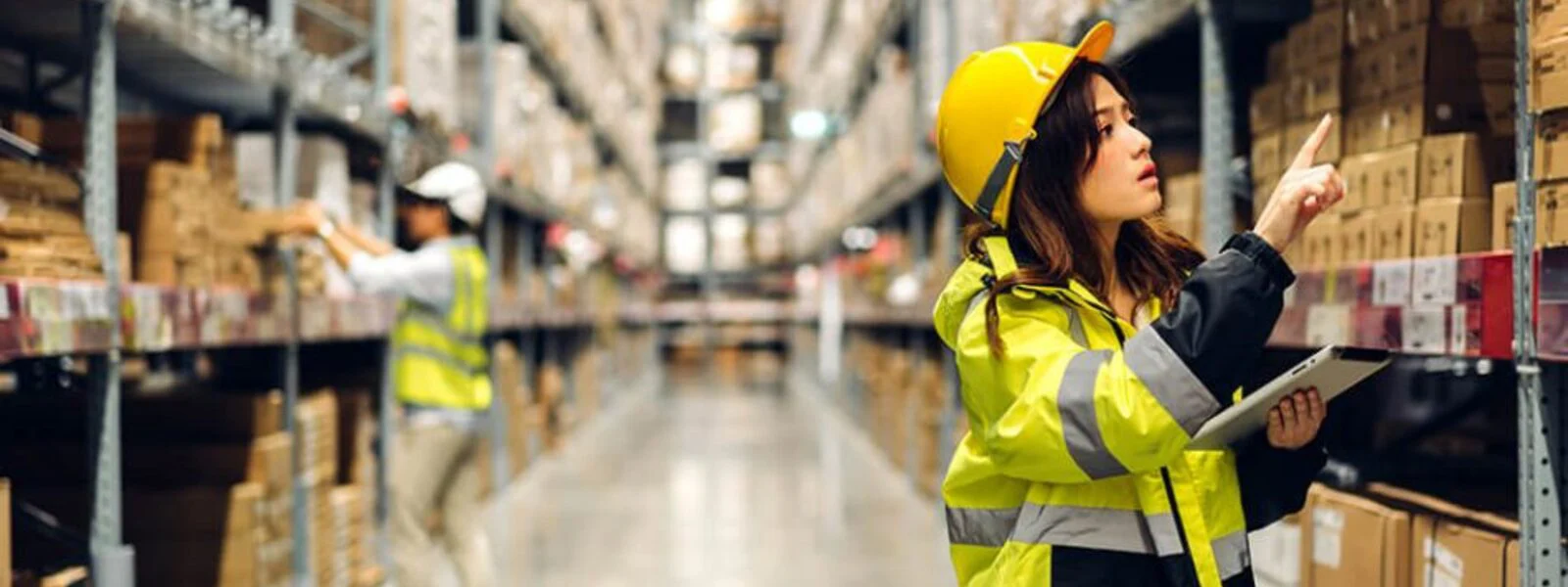 Warehouse worker checking stock with a tablet